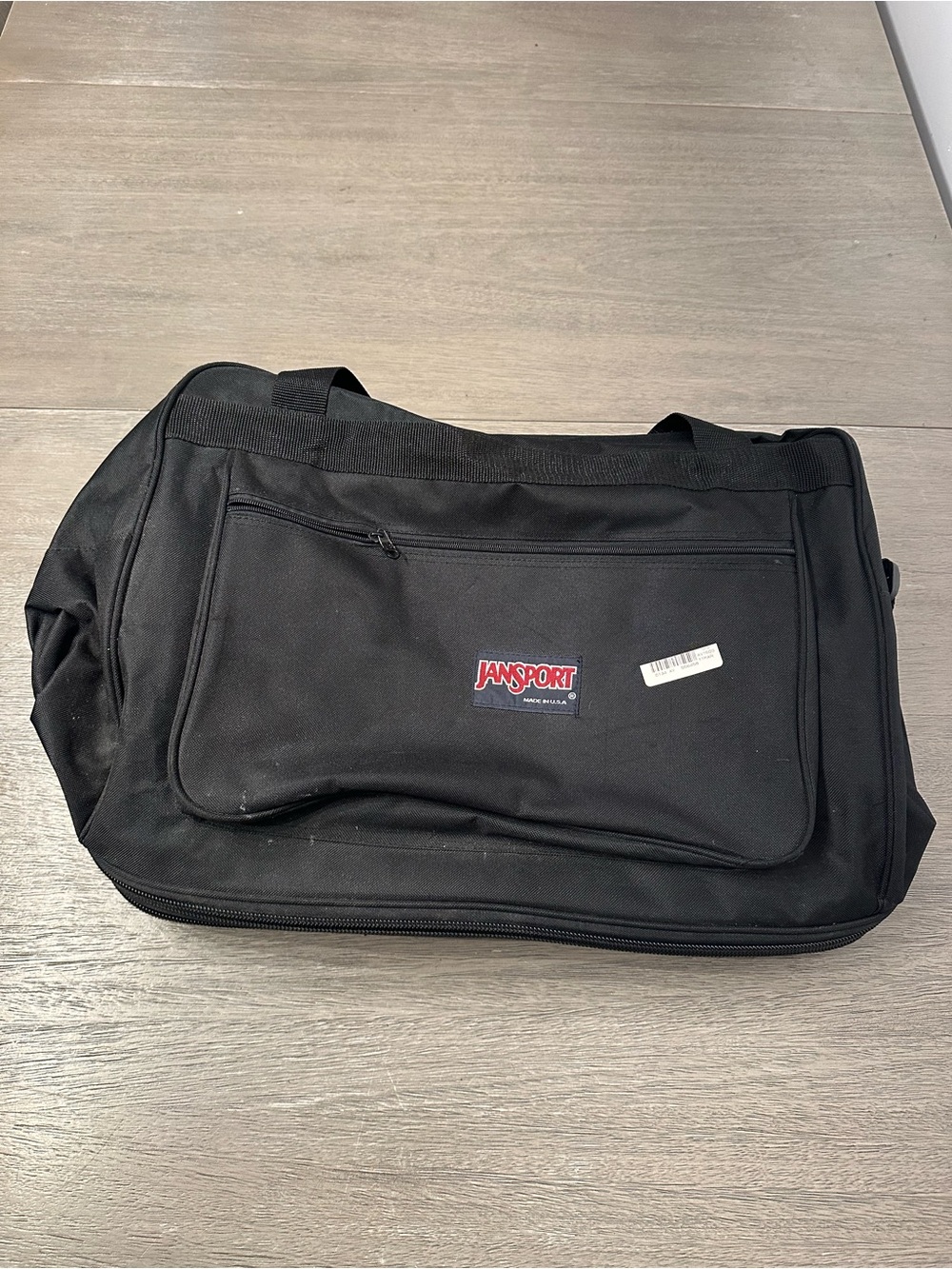 Jansport Black Duffel with Front Zip Pocket and wheels